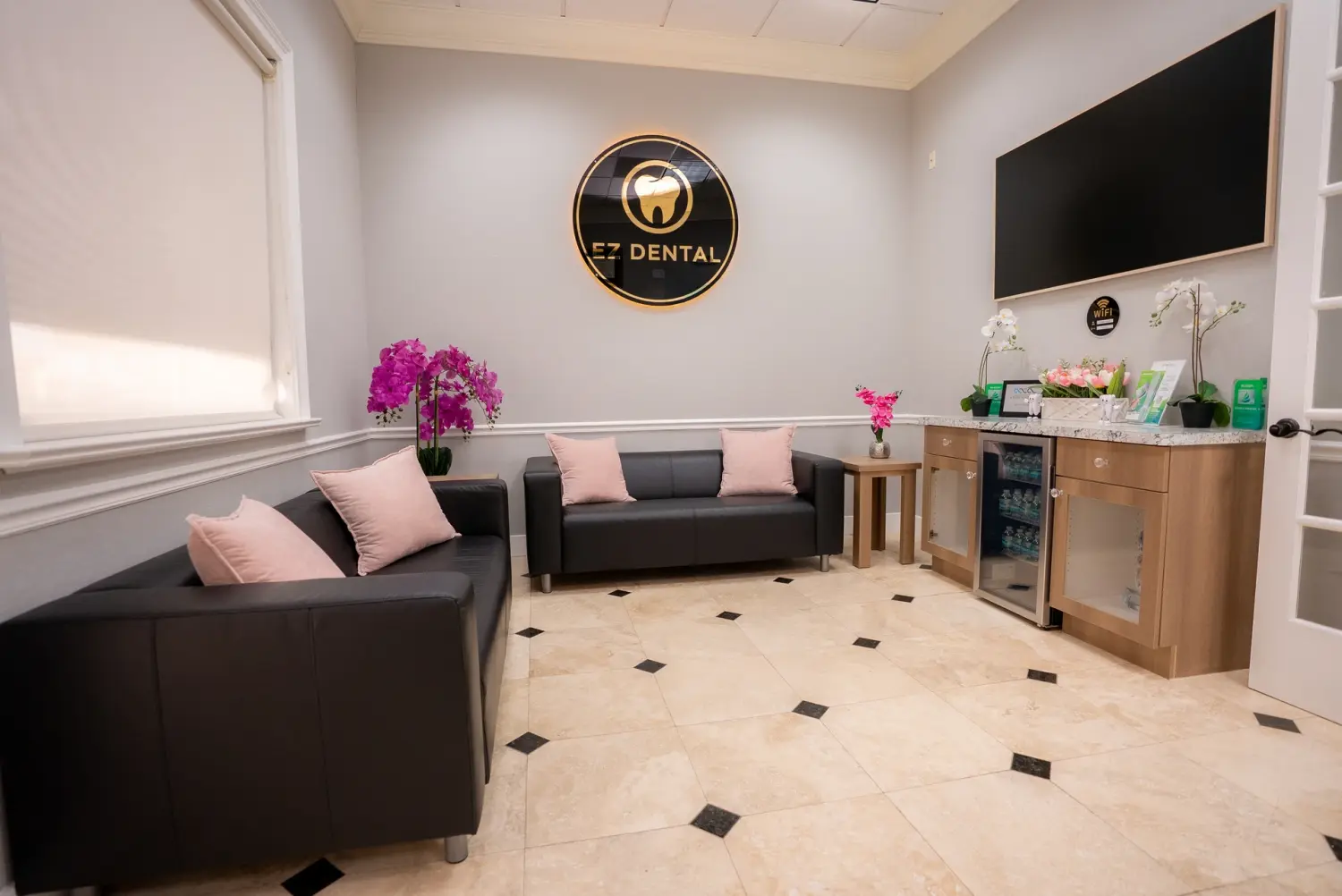 EZ Dental waiting area with refreshment station and cozy seating in Fort Myers, FL