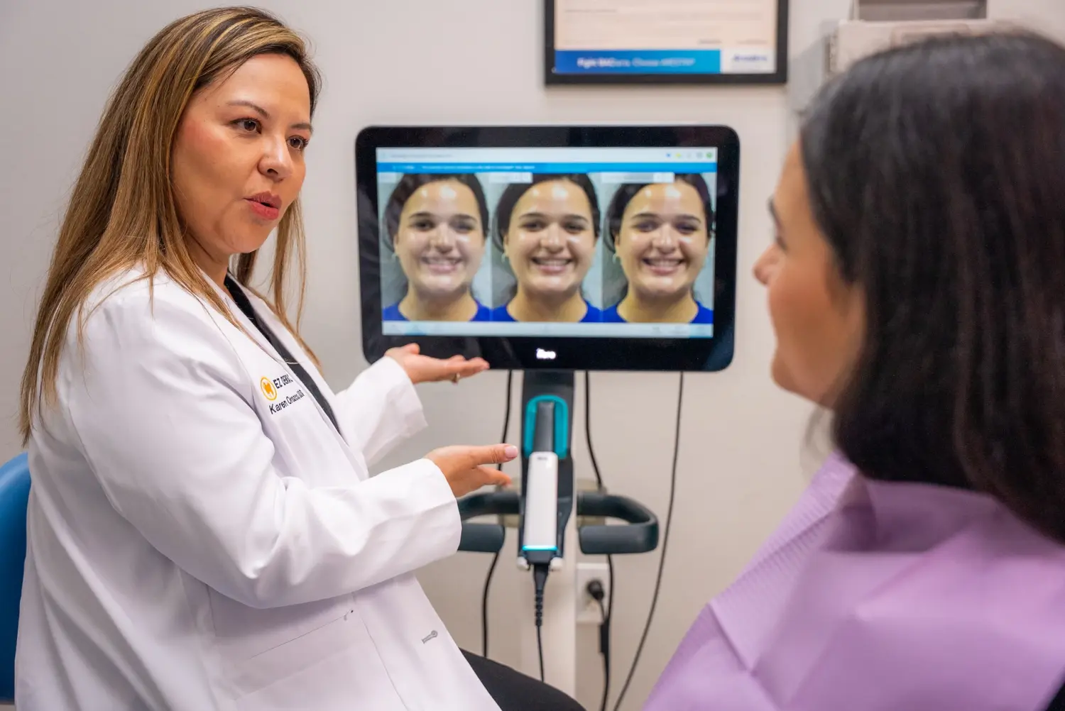 EZ Dental dentist showing smile design simulations on monitor to patient in Fort Myers, FL